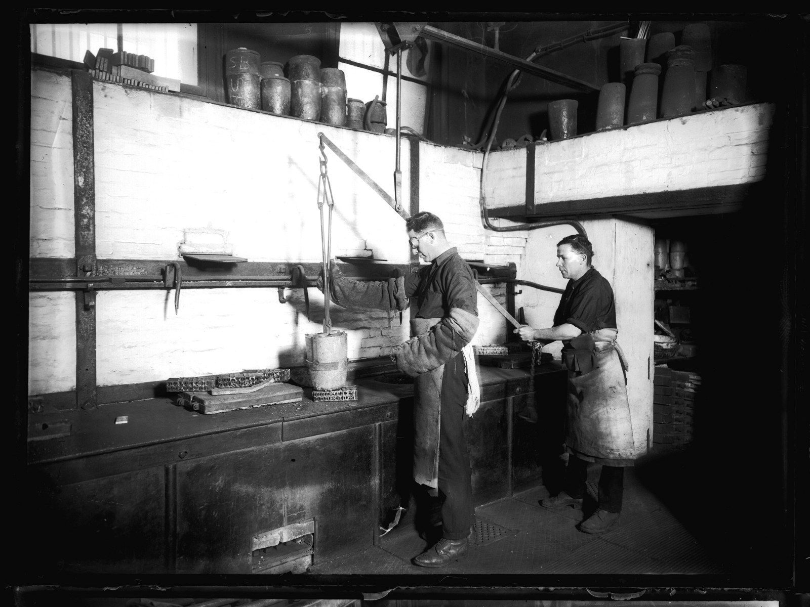 Workmen in the melting room at the Sydney Mint, June 1926