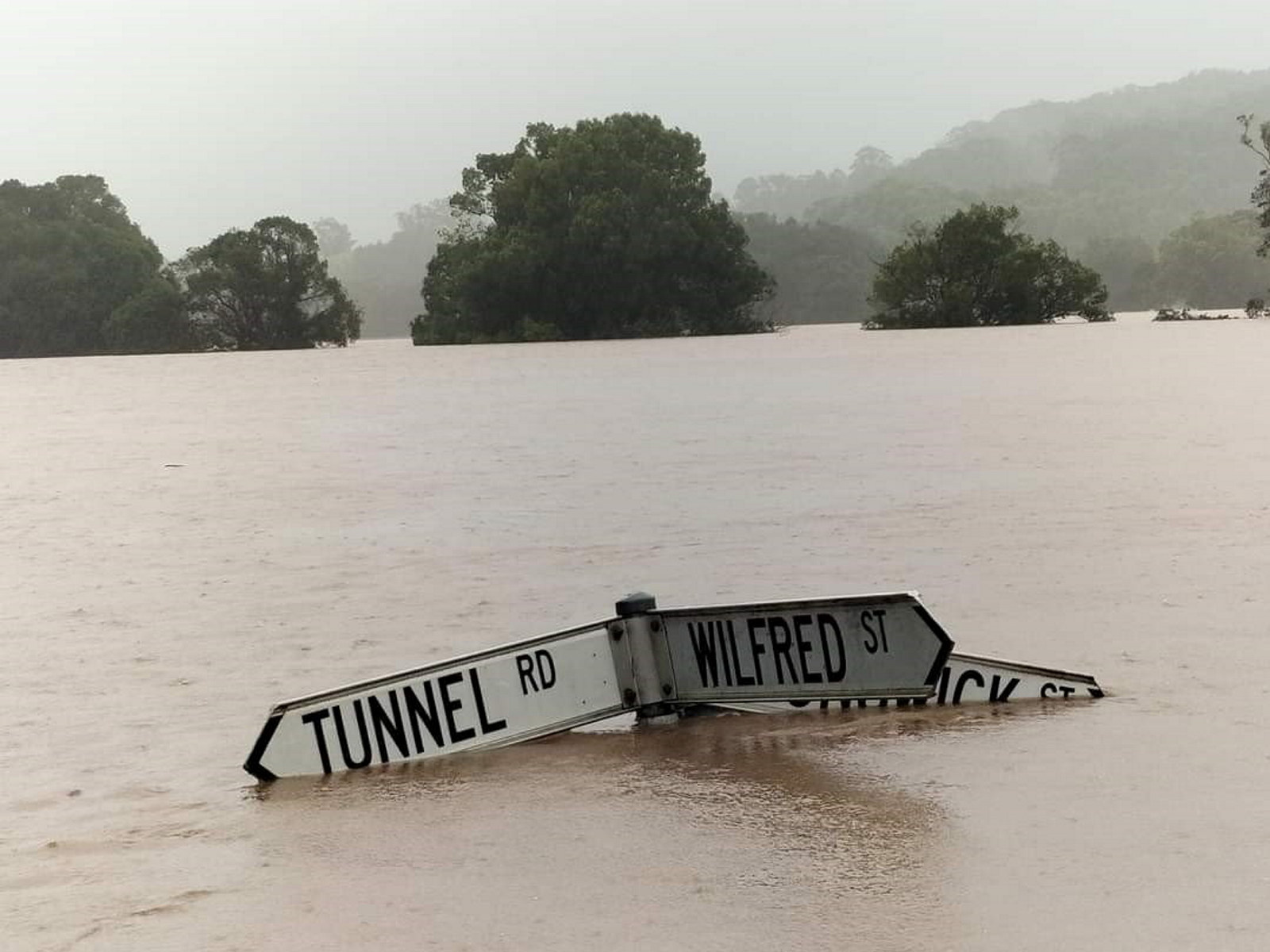 Street sign almost completely submerged during the NSW floods in 2022 in the north Byron area (submission 0900)