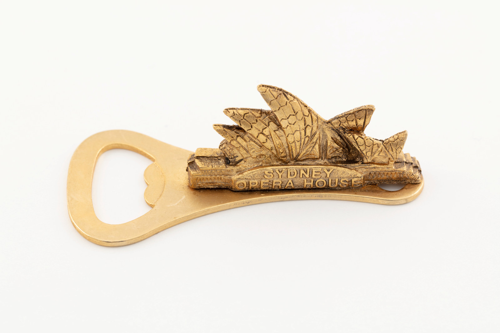 K539-122 Bottle Opener (1 of 282), Sydney Opera House handle, brass, maker unknown, place of production unknown, date unknown