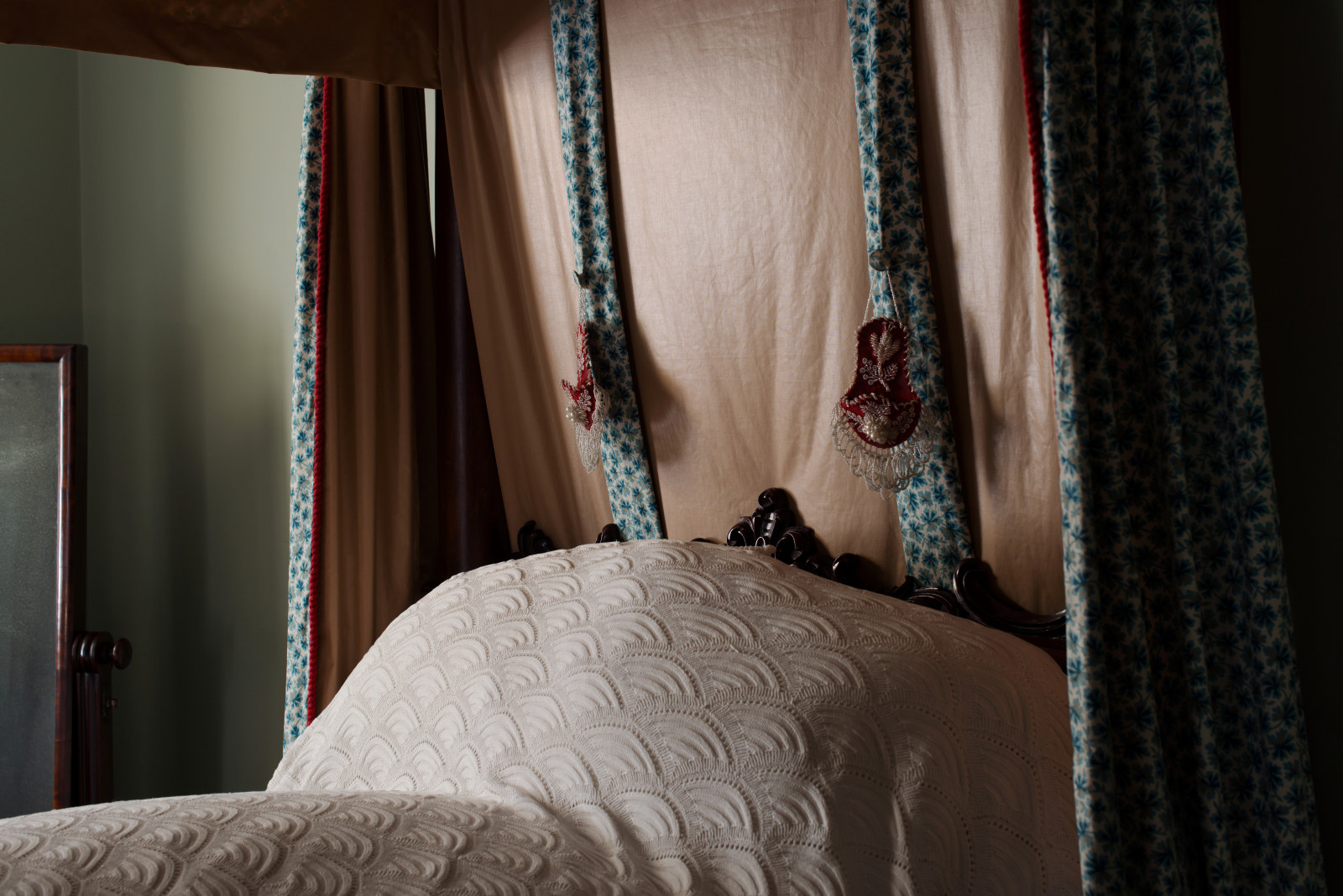 Detail of the four poster bed and beaded watch pockets in the Principal bedroom, Vaucluse House  