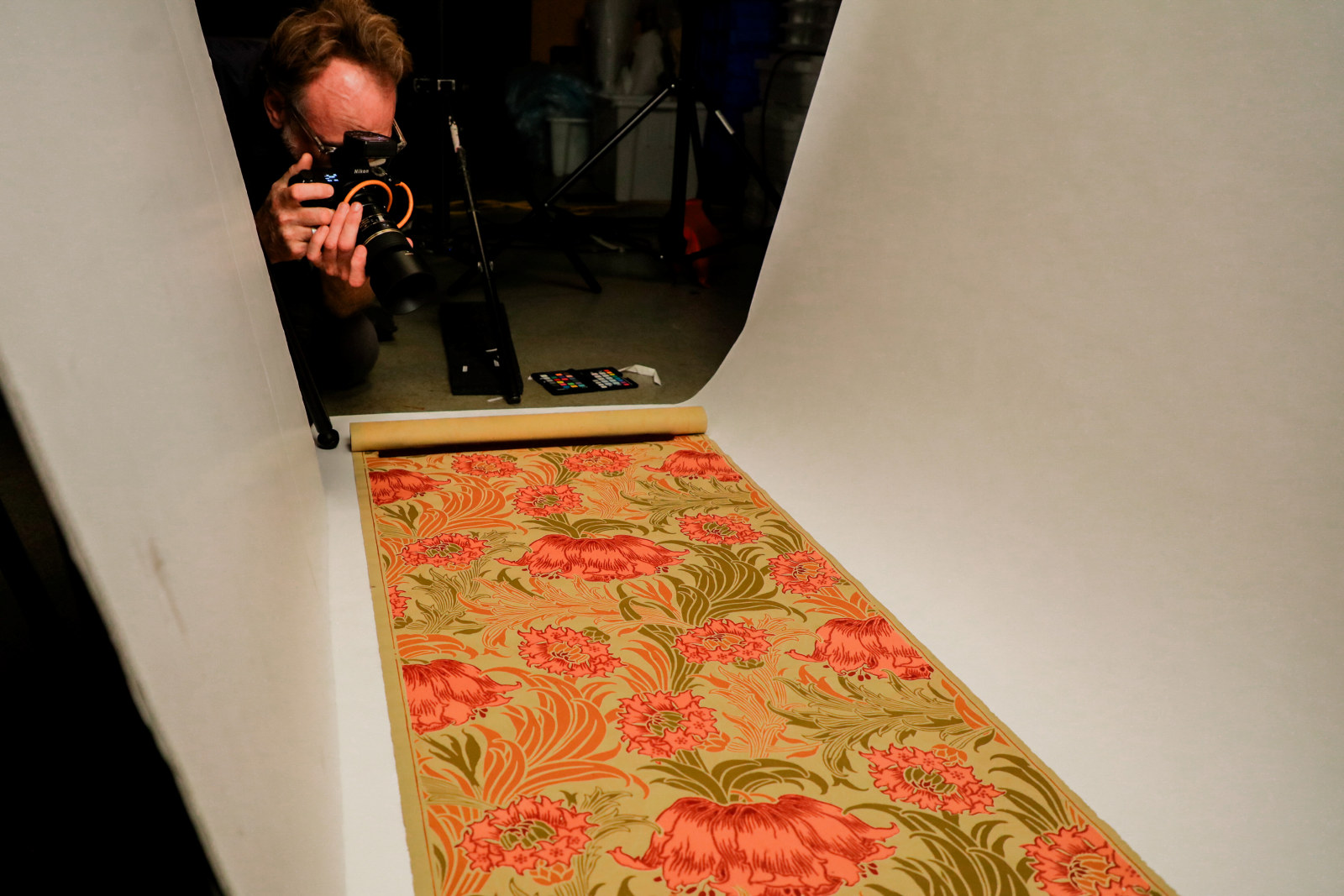 Digitisation in action - photographer Joshua Morris shooting a wallpaper from the John and Phyllis Murphy collection, Museums Discovery Centre