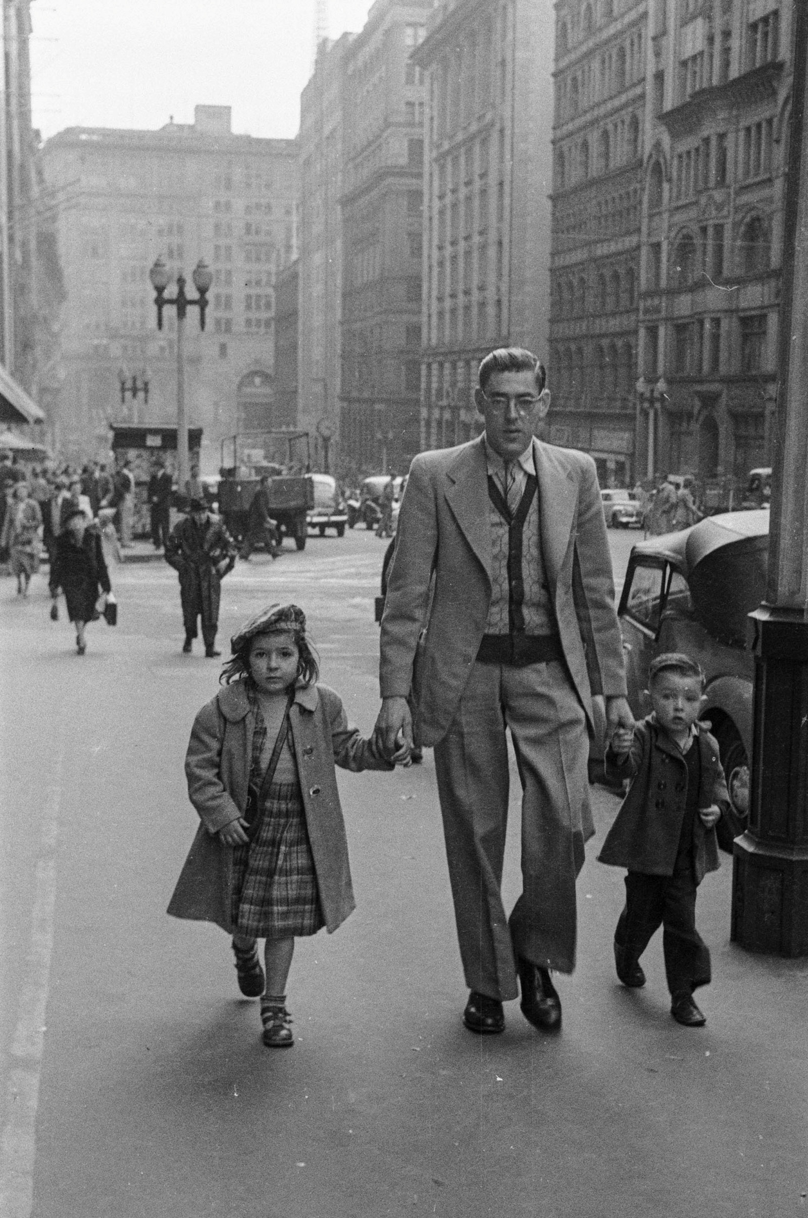 Black and white street photograph of pedestrians