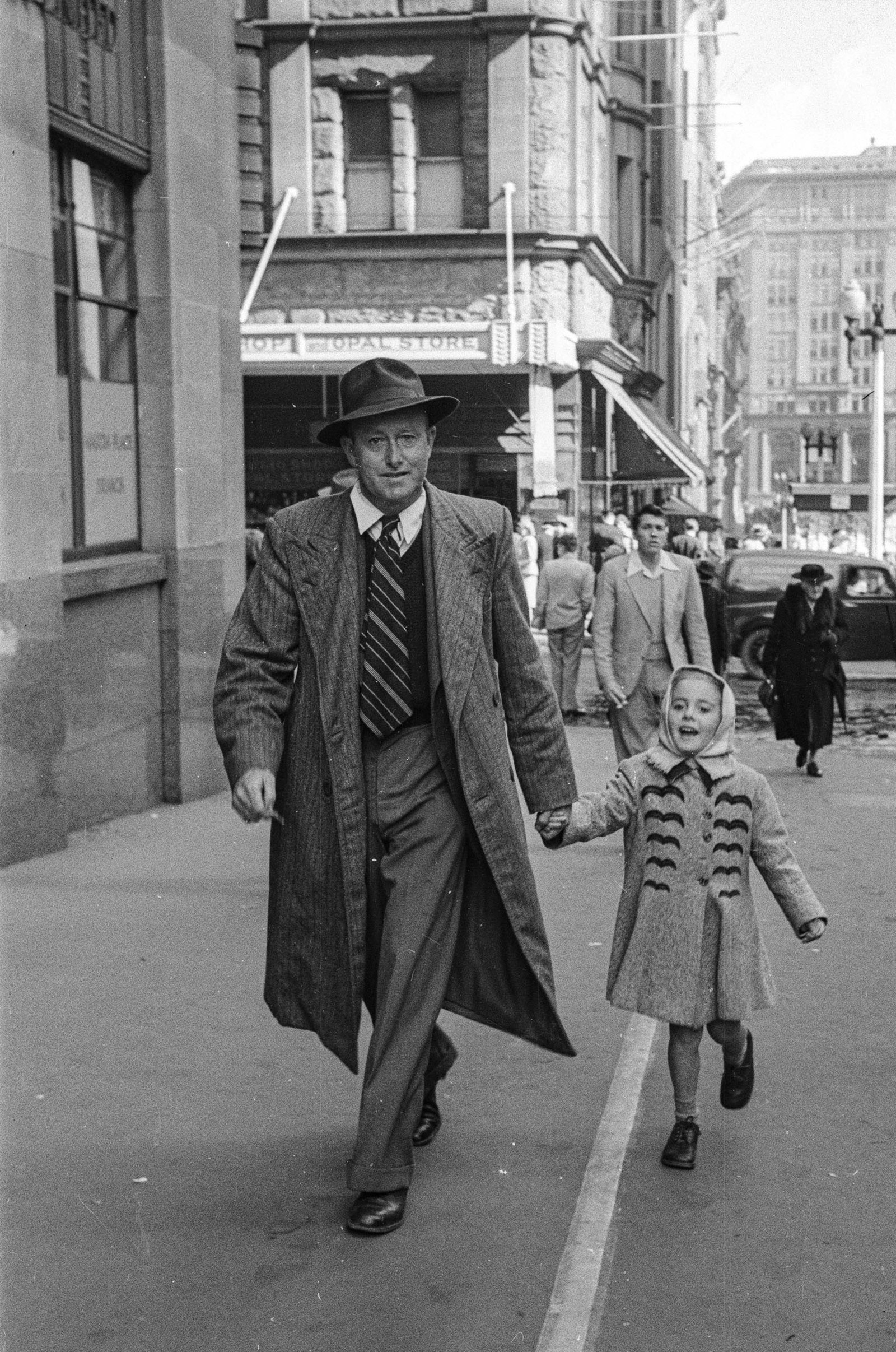 Black and white street photograph of pedestrians