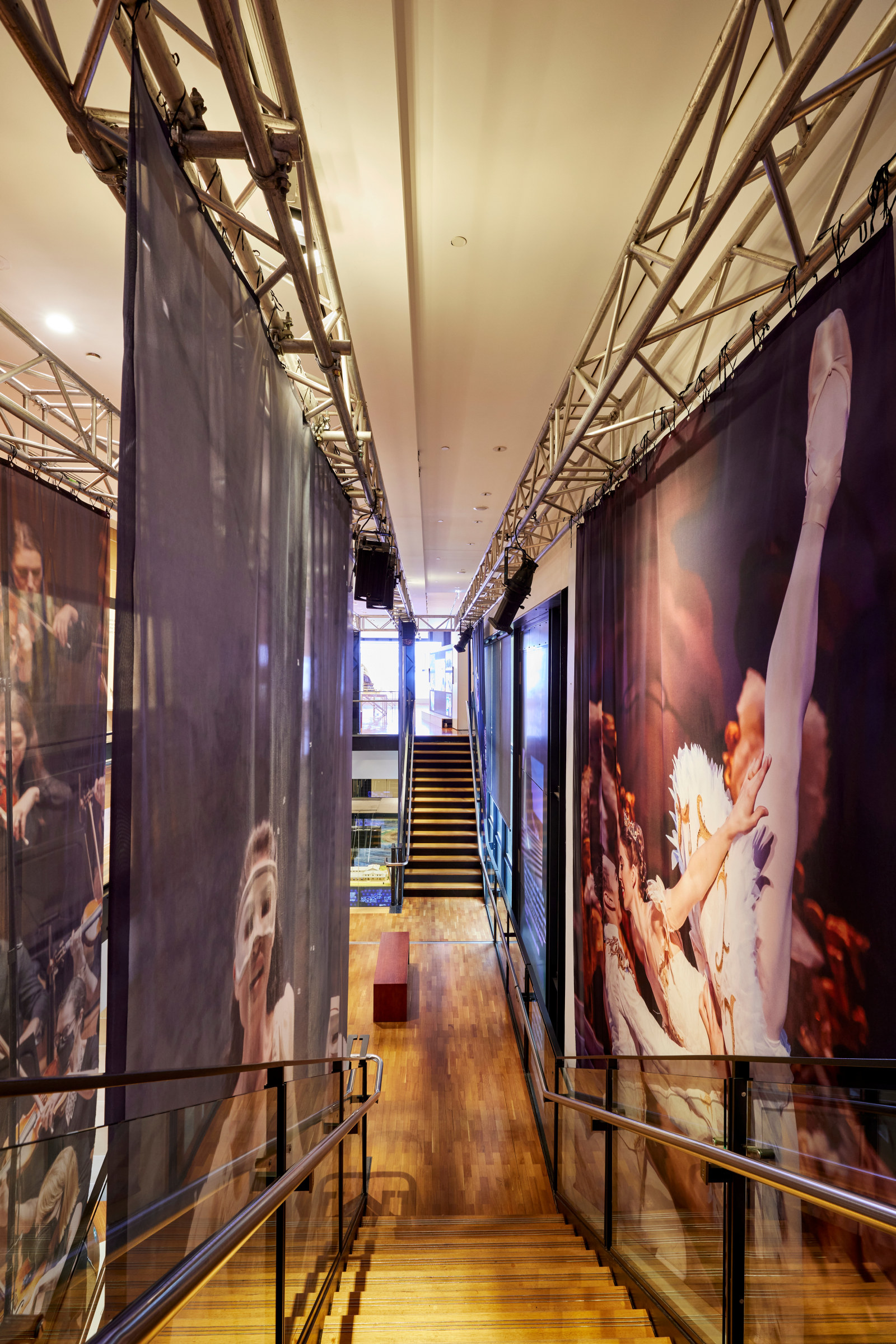 View of the Australian Ballet 'The sleeping beauty (detail)' [right] and the Opera Australia 'Mariana Hong in Falstaff (detail) ' [left] stairwell banners - The People's House marketing & installation photoshoot